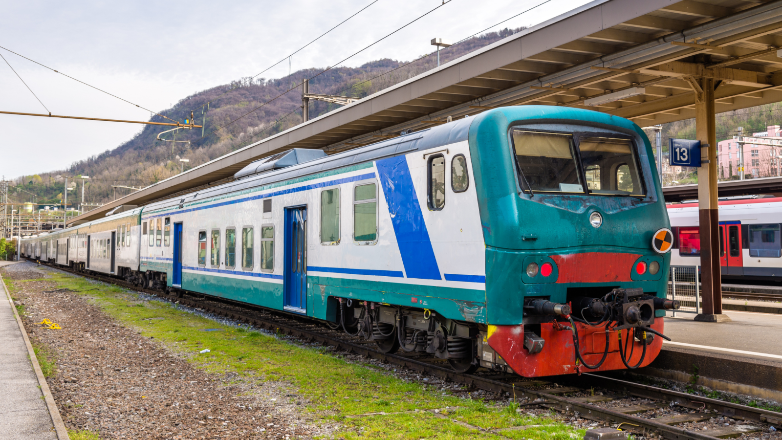An Italian regional passenger train at a Swiss border station in Chiasso, Switzerland.